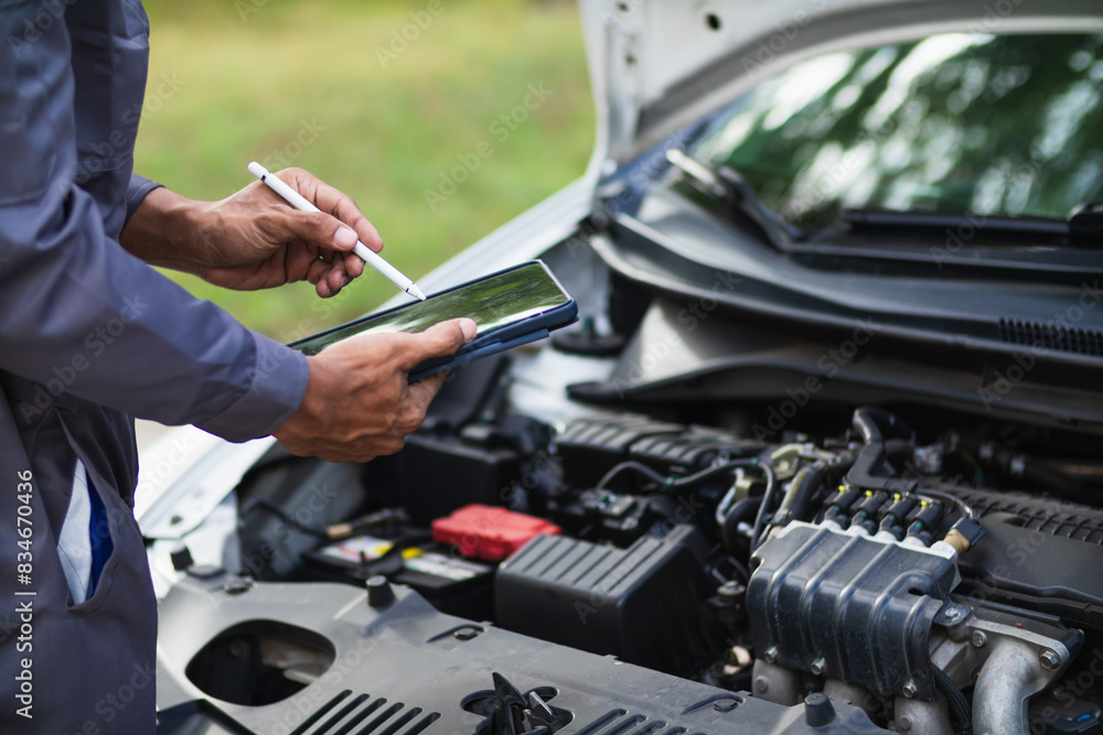 car service center mechanics are checking condition car and engine make sure they are ready use and in perfect condition according center warranty. periodic vehicle inspections for safety in driving.