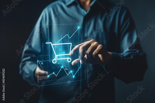 Merchants touch virtual sales growth charts and shopping cart ICONS on a transparent screen, representing the concept of business success. This person is using a tablet to analyze the performance of a