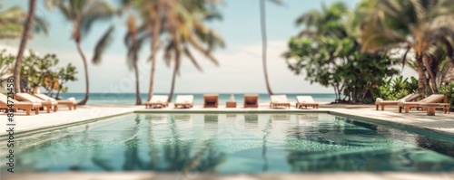 poolside scene at a luxurious tropical resort with rows of loungers under palm trees during sunset.