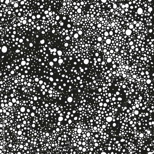 White grunge texture of bubbles or drops of ink splashed on black seamless background
