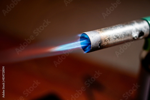 Lit blowtorch with blue flame