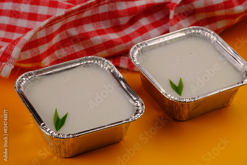 kue lumpur surga is a sweet dessert made from coconut milk, pandan leaves, eggs, rice flour, sugar.  photo