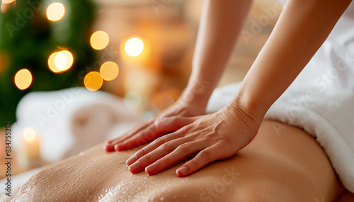 Wallpaper Mural Close-up of hands performing a massage on a person's back, warm tones, bokeh lights background, wellness concept. Generative AI Torontodigital.ca