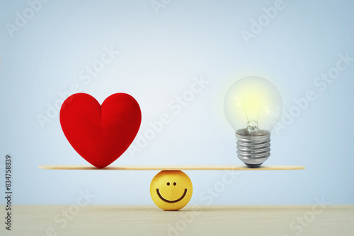 Photography Heart and light bulb on scale - Concept of balance between heart and brain