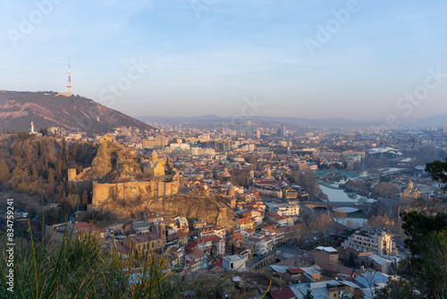 Sunrise in the city. Narikala fortress, mosque, Metekhi church, TV tower, Mtkvari river. Tbilisi, Georgia photo