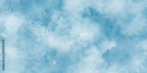 Beautiful painted cloudy natural blue watercolor cloudy sky clouds, Watercolor stain with hand paint pattern on blue canvas, Clouds and mist background on blue, Creative vintage light sky.