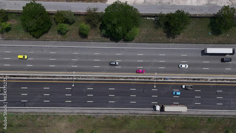 Top view of the highway car road. Aerial view of motorway junction, toll way, road traffic, Highway an important infrastructure, Expressway road, transportation and travel concept Top view of the highway car road. Aerial view of motorway junction, toll way, road traffic, Highway an important infrastructure, Expressway road, transportation and travel concept