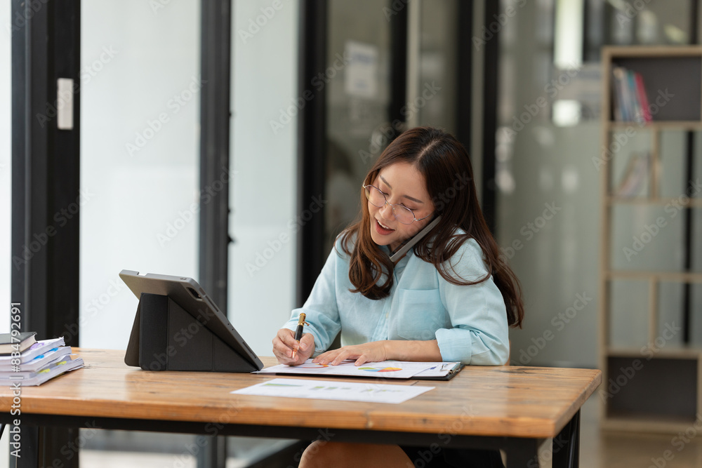 Asian business woman working with smartphone Asian business woman working with smartphone