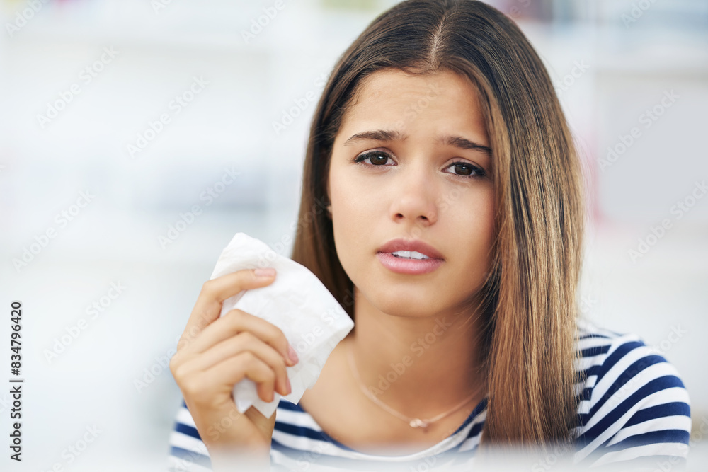 Young woman, sick and tissue paper in flu season, allergies or infection with portrait. Female student, anticipation or napkin for virus in living room, FLIRT COVID or mucus congestion and fever Young woman, sick and tissue paper in flu season, allergies or infection with portrait. Female student, anticipation or napkin for virus in living room, FLIRT COVID or mucus congestion and fever