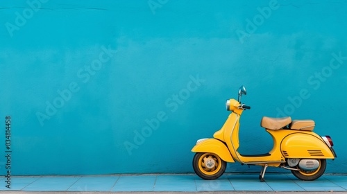 Generated imageA yellow vintage scooter rests against a vibrant blue wall, creating a whimsical scene with classic aesthetics. photo