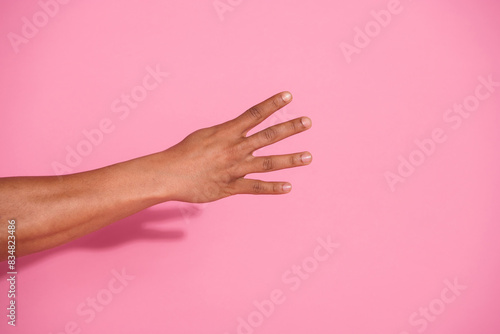 Photo of person showing hand four fingers number isolated pastel color background