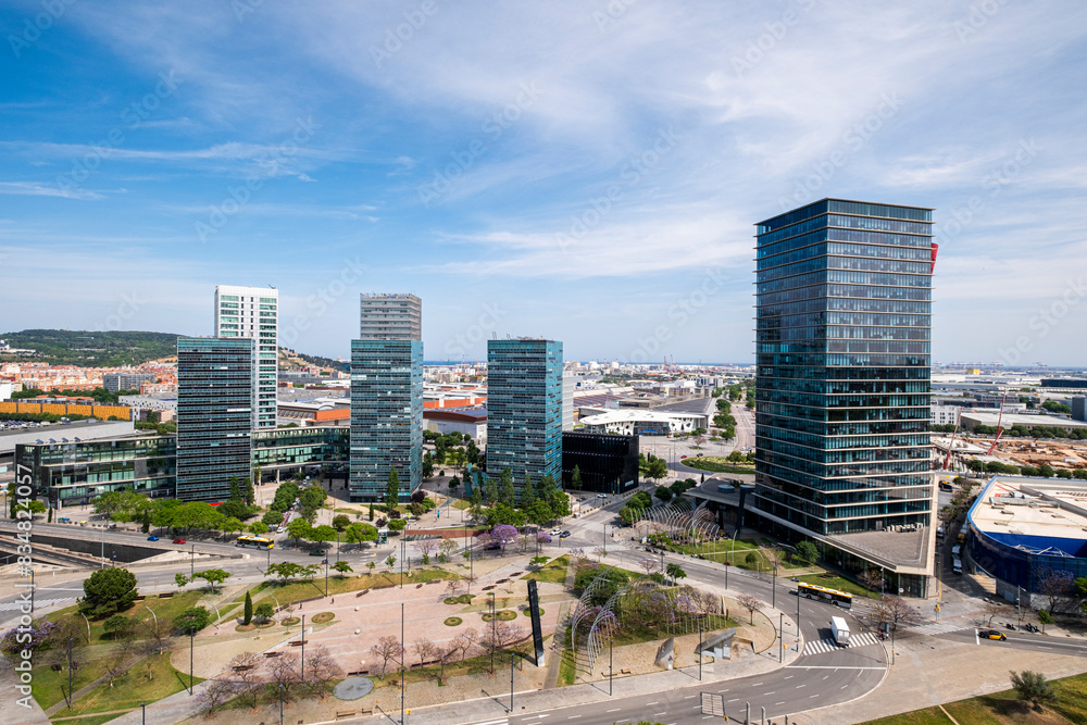 This image captures the impressive skyline of Plaza Europa, along with parks and greenery, in Hospitalet de Llobregat, Catalonia, Spain This image captures the impressive skyline of Plaza Europa, along with parks and greenery, in Hospitalet de Llobregat, Catalonia, Spain