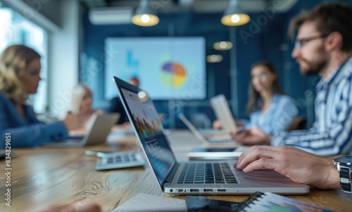 Collaboration, laptop and workshop with business people in modern office for discussion or planning. Computer, meeting or training with man and woman employee team in boardroom for development