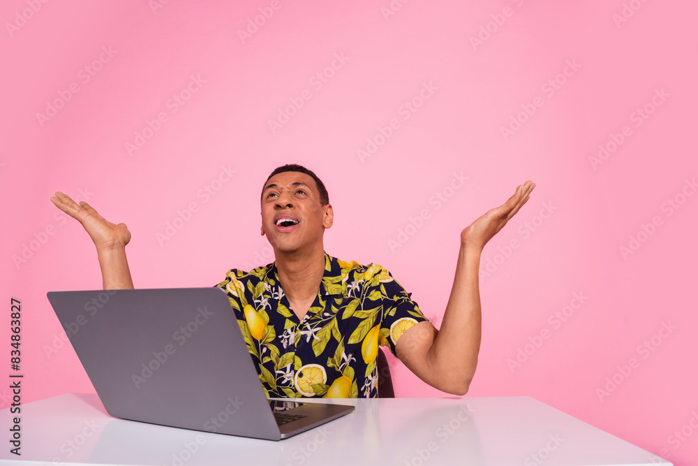 Photo of worker guy sit desk working laptop scream with despair isolated pastel color background Photo of worker guy sit desk working laptop scream with despair isolated pastel color background
