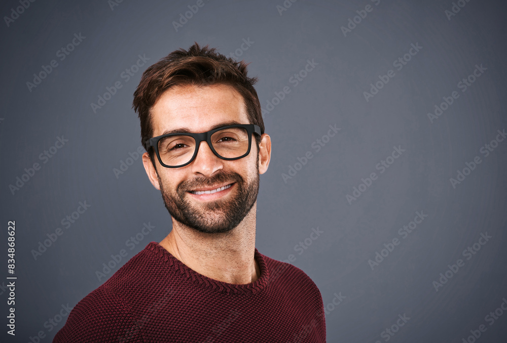 Obraz premium Studio, glasses and man with portrait, confident and wellness with eye care, product and lens for vision. Black background, face and happiness for person, prescription and eyewear with fashion in USA