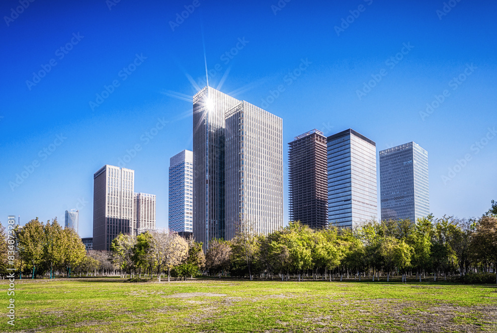 Modern Urban Skyline with Green Park on Sunny Day Modern Urban Skyline with Green Park on Sunny Day