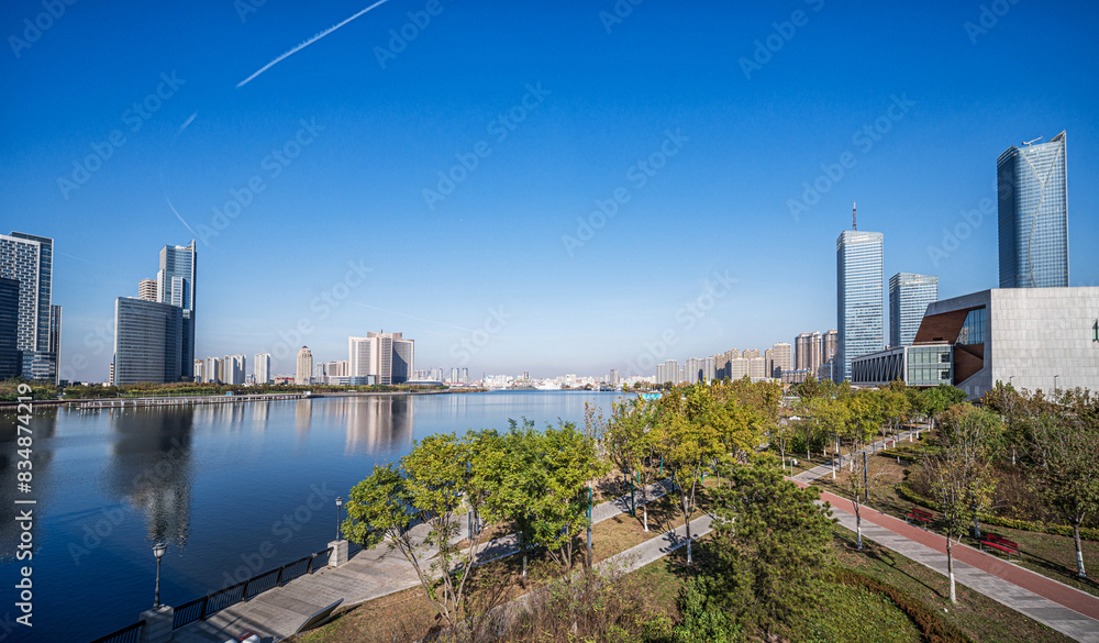 Fototapeta premium Modern Urban Waterfront with Skyscrapers