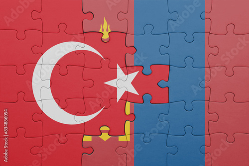 puzzle with the colourful national flag of mongolia and flag of turkey.