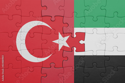 puzzle with the colourful national flag of united arab emirates and flag of turkey.