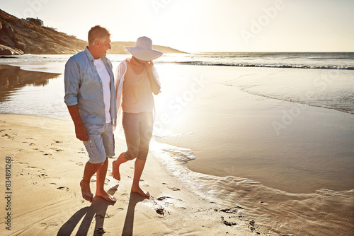 Happy couple, walking and beach for holiday on vacation or coast for getaway, travel and island in Bali. Woman, man and relationship for love or marriage anniversary by ocean at sunset in Indonesia #834891268