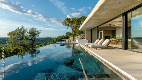 A luxury villa with an infinity pool  expansive glass walls  and a stunning view of the surrounding landscape  epitomizing modern elegance 