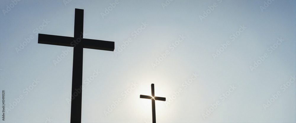Christian symbol of the cross in silhouette against a white backdrop, with space for text relating to faith and religion