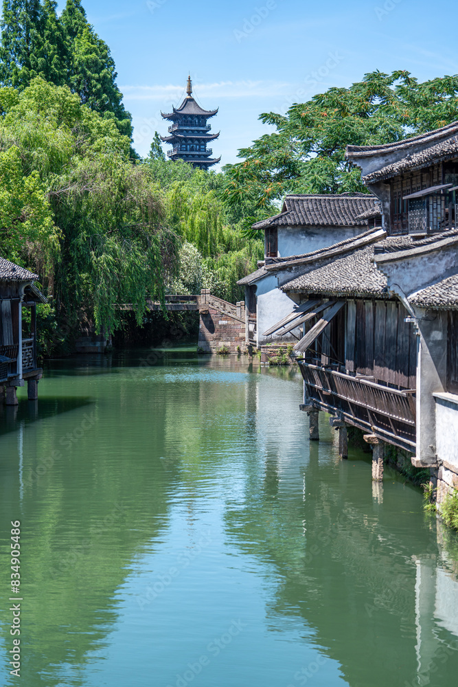 Discover China Wuzhen's ancient architecture, where old stone paths and bridges reflect on peaceful waters. Experience the charm of historic buildings along serene rivers.. Discover China Wuzhen's ancient architecture, where old stone paths and bridges reflect on peaceful waters. Experience the charm of historic buildings along serene rivers..