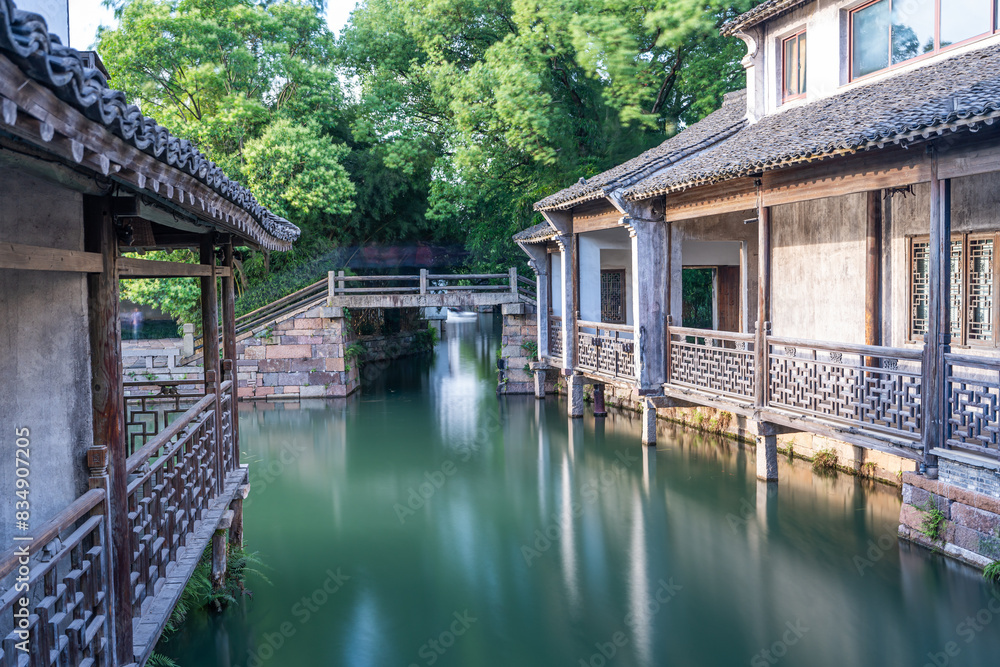 Discover China Wuzhen's ancient architecture, where old stone paths and bridges reflect on peaceful waters. Experience the charm of historic buildings along serene rivers.. Discover China Wuzhen's ancient architecture, where old stone paths and bridges reflect on peaceful waters. Experience the charm of historic buildings along serene rivers..