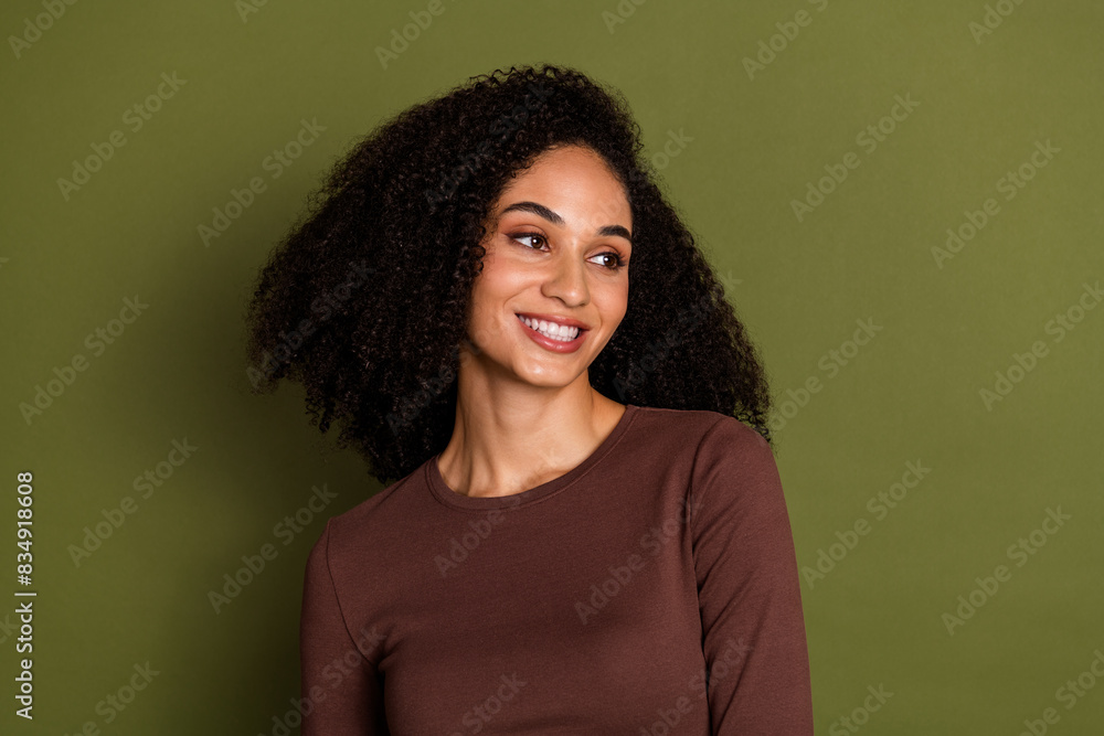 Fototapeta premium Photo portrait of lovely young lady look empty space dressed stylish brown garment isolated on khaki color background