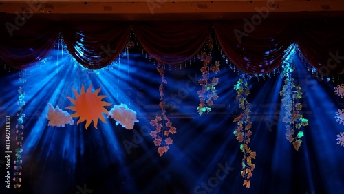 Decoration on the performance stage with lighting effects from behind creates a dark mood