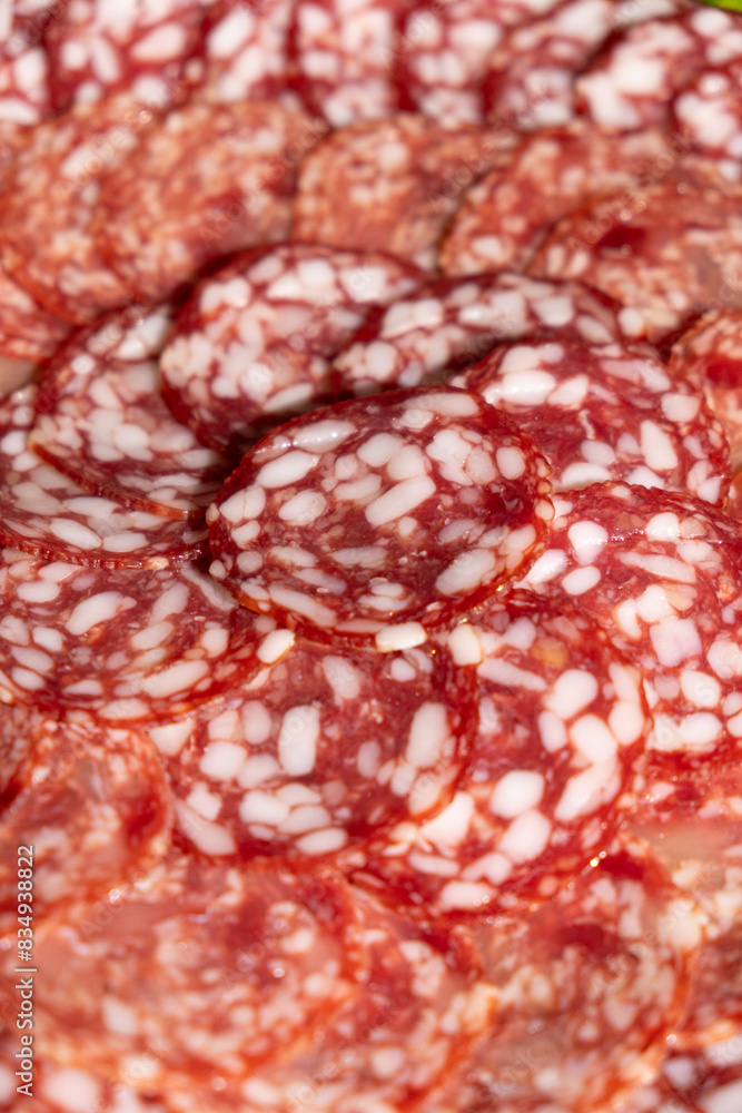 Thin slices of smoked sausage close-up. Thin slices of smoked sausage close-up.