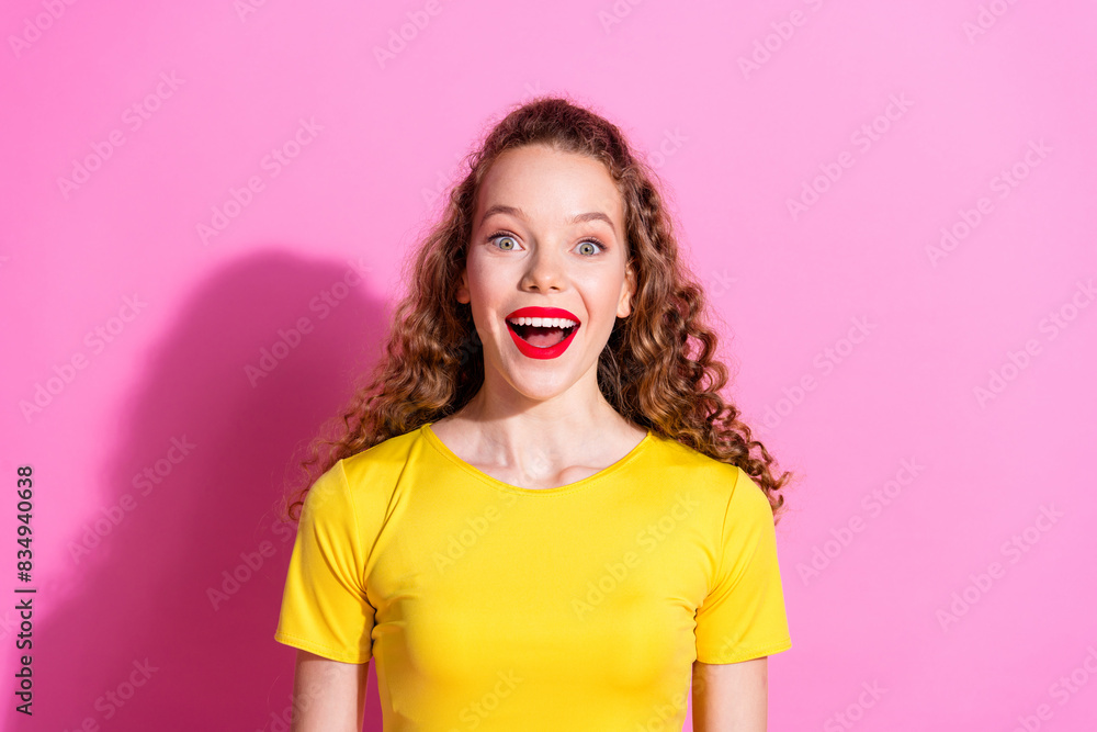 Photo of excited positive girl wear yellow top smiling empty space isolated pink color background Photo of excited positive girl wear yellow top smiling empty space isolated pink color background