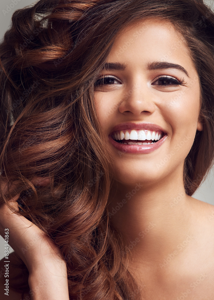 Obraz premium Beauty, hair and portrait of confident woman in studio on gray background for keratin or shampoo treatment. Aesthetic, cosmetics and wellness with natural model at salon for conditioning or haircare
