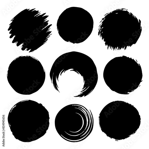 Abstract black brush stroke circles with creative designs, bold patterns, and elements