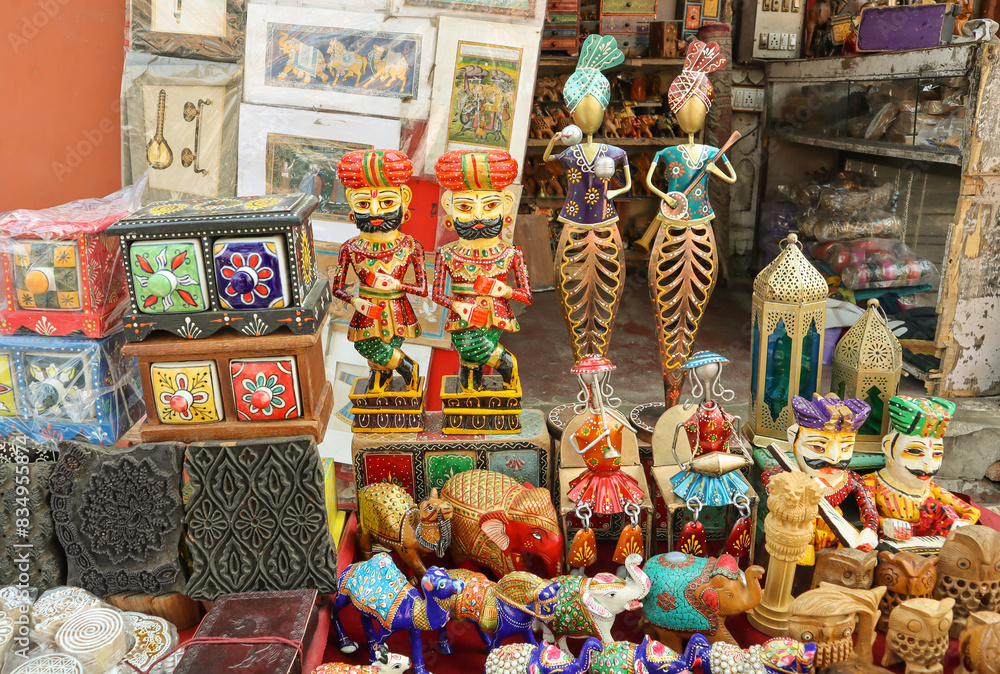 Fototapeta premium A Collection of Colorful Dolls and toys made from wood and metal representing Rajasthani culture and sold as souvenirs at Jaipur in India.