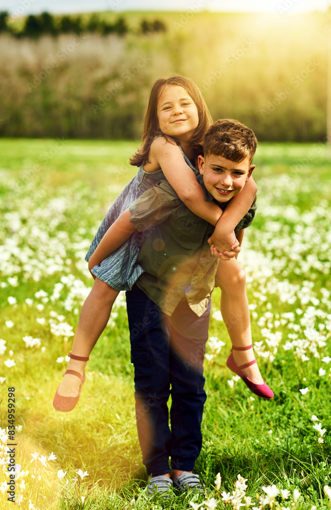 Fototapeta premium Siblings, portrait and piggyback with smile in park together for support, bonding and playing in summer. Kids, boy and girl in nature, garden and countryside for kindness as brother and sister