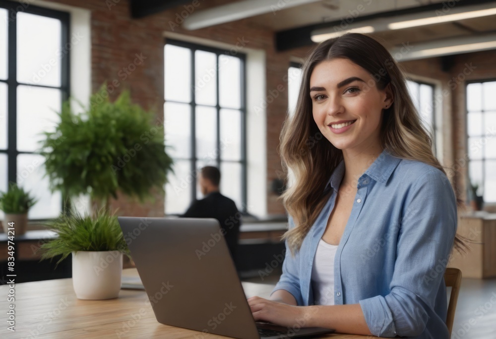A confident woman working on a laptop in a bright office space, embodying professionalism and style. A confident woman working on a laptop in a bright office space, embodying professionalism and style.