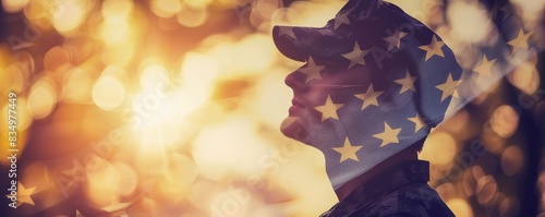 Silhouette of a soldier with an American flag overlay, set against a beautiful sunset bokeh background - representation of national pride. photo