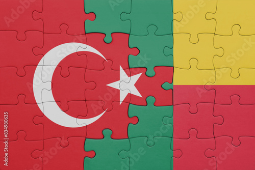 puzzle with the colourful national flag of benin and flag of turkey.