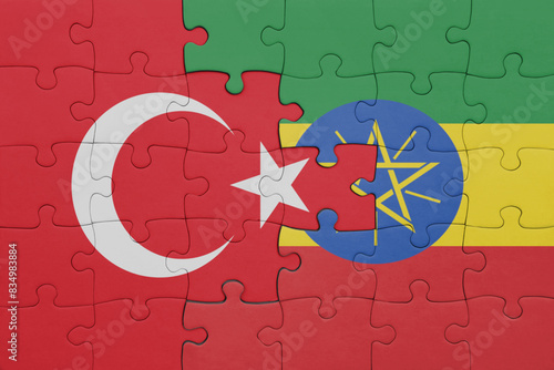 puzzle with the colourful national flag of ethiopia and flag of turkey.