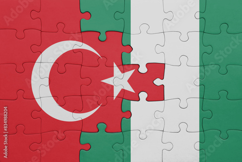 puzzle with the colourful national flag of nigeria and flag of turkey.