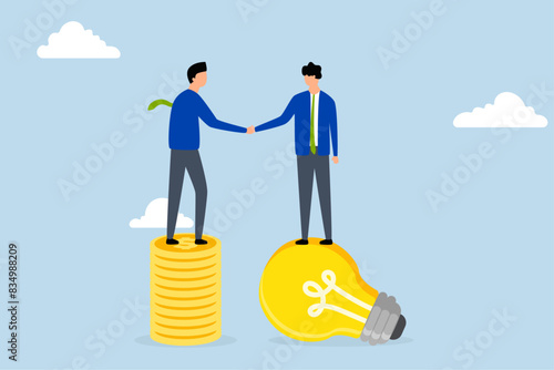 Idea pitching, businessman standing with light bulb idea, shaking hands with VC on stack of coins.