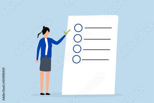 Self assessment, woman gives list of checkbox achievements on notebook paper.