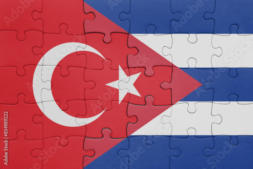 puzzle with the colourful national flag of cuba and flag of turkey.