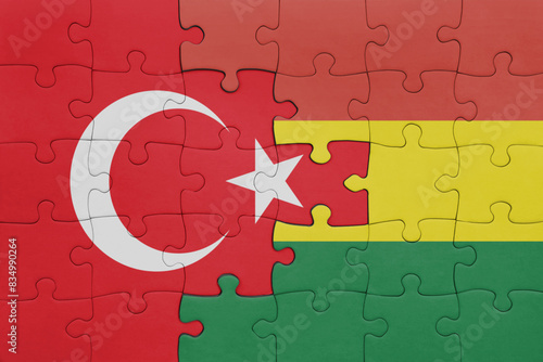 puzzle with the colourful national flag of bolivia and flag of turkey.