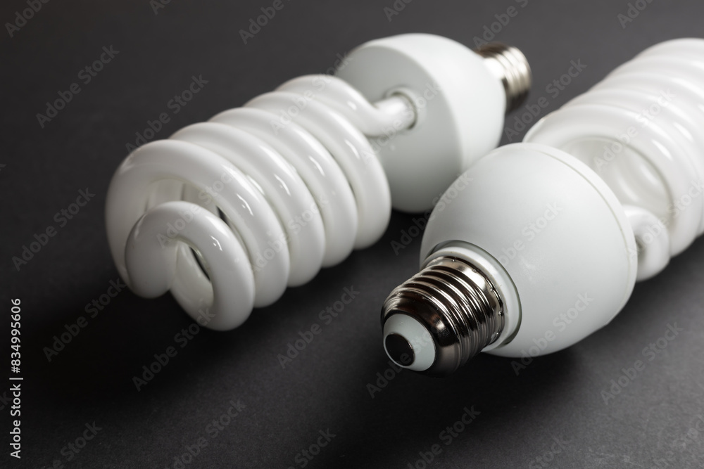 Energy saving fluorescent light bulb on dark background Energy saving fluorescent light bulb on dark background