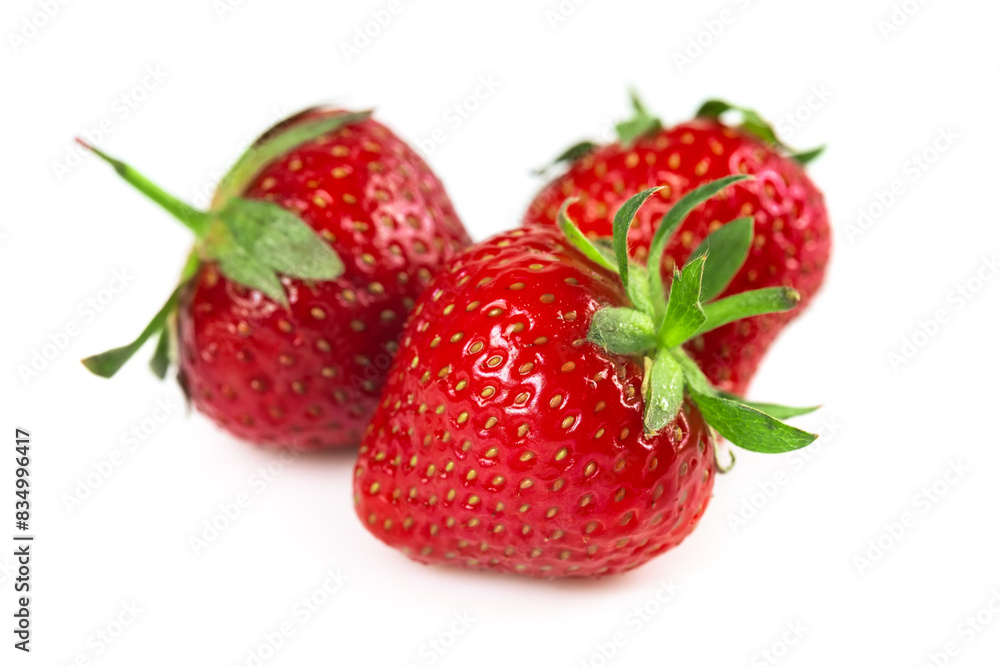 Three strawberries with strawberry leaf on white background Three strawberries with strawberry leaf on white background