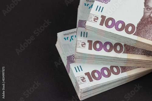 Stack of ukrainian money hryvnia. grivna, hryvna with 1000 banknotes photo