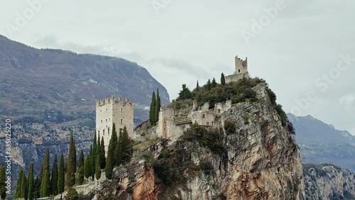 Arco Castle ruined castle located on a prominent spur high above Arco and the Sarca Valley in Trentino. Aerial view photo