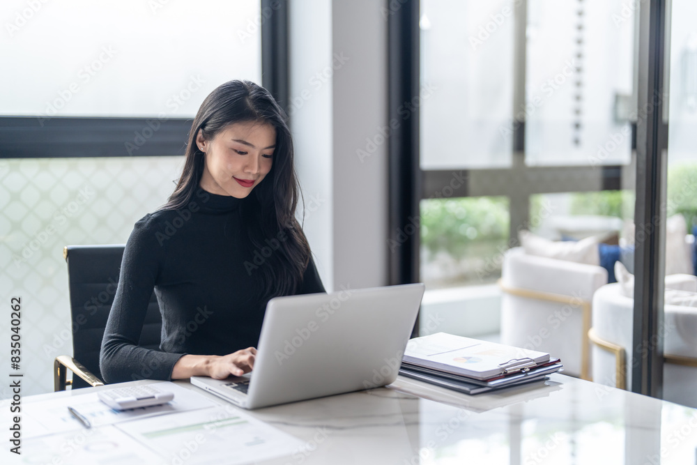 Beautiful confident asian business woman working with laptop Hands typing keyboard. Professional investor working new start up project. business planning in office. Technology business Beautiful confident asian business woman working with laptop Hands typing keyboard. Professional investor working new start up project. business planning in office. Technology business